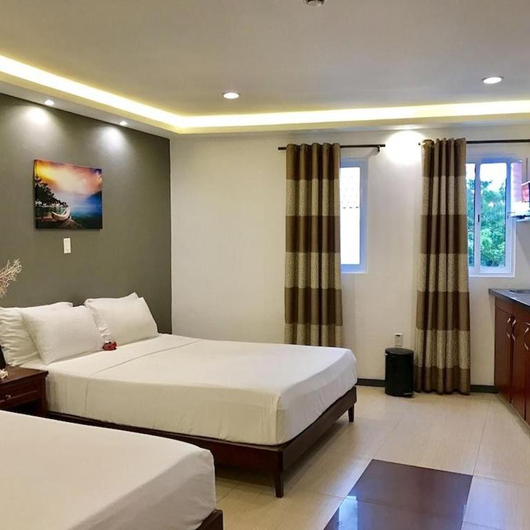 Postel nebo postele na pokoji v ubytování Curacao Suites Hotel