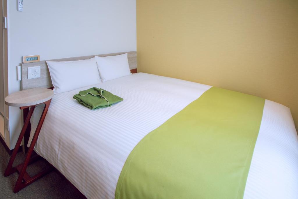 Postel nebo postele na pokoji v ubytování Kuretake Inn Premium Meieki minami