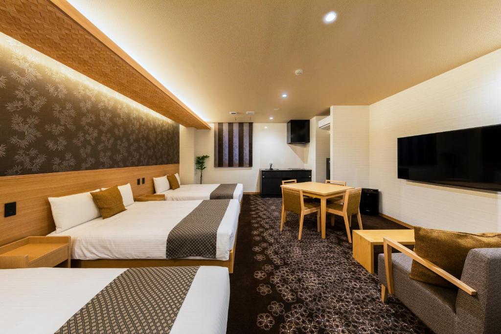 Postel nebo postele na pokoji v ubytování Chiyokura HOTEL SHUKU Nagoya