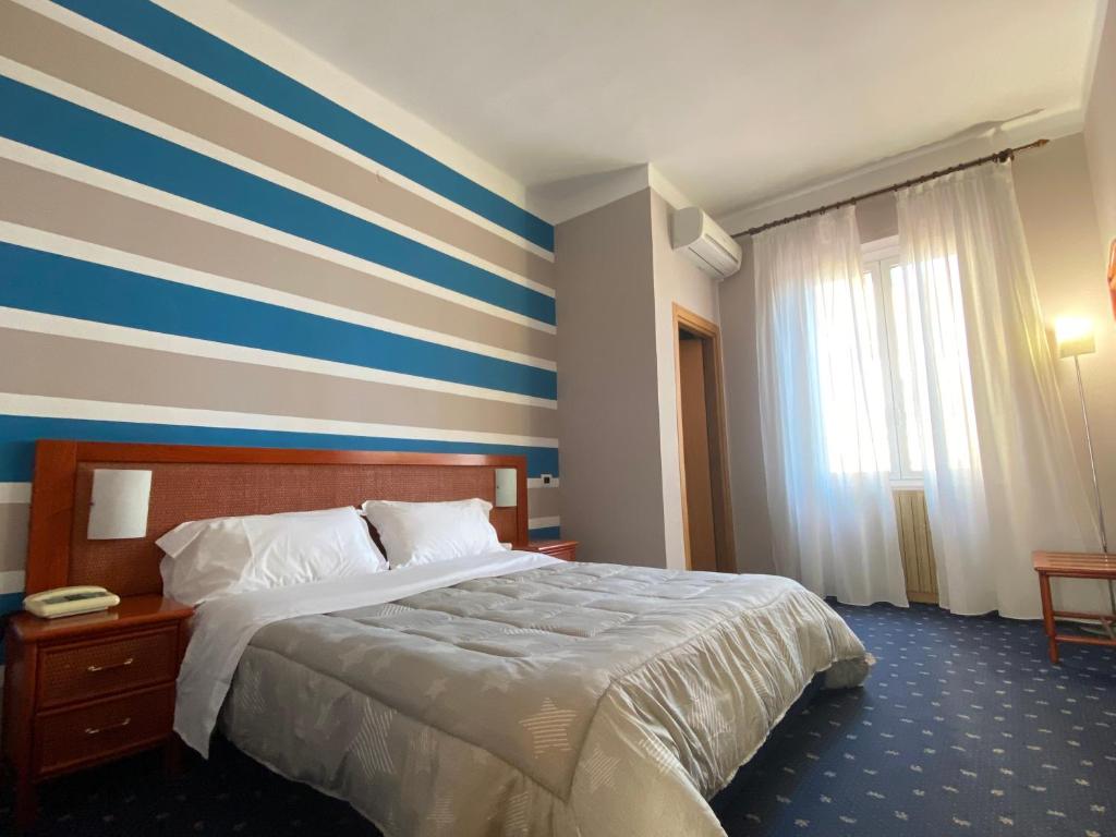 Postel nebo postele na pokoji v ubytování Hotel Kristina