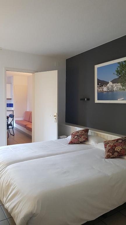 Postel nebo postele na pokoji v ubytování Hotel S´Aguarda