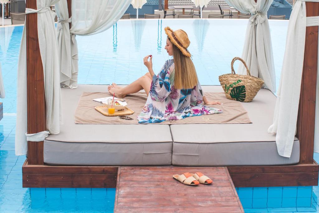 A bed or beds in a room at Orka Cove Hotel Penthouse & Suites Adults Only
