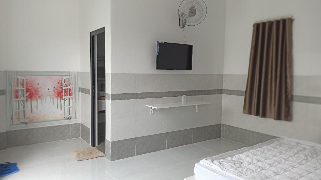 Postel nebo postele na pokoji v ubytování Cát Khuê Motel