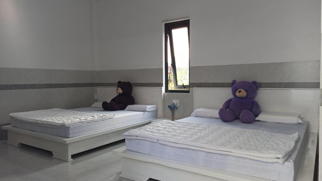 Postel nebo postele na pokoji v ubytování Cát Khuê Motel