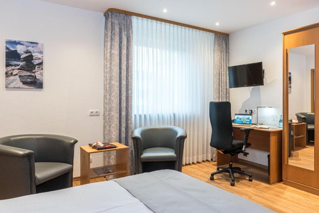 TV a/nebo společenská místnost v ubytování Hotel Elysee
