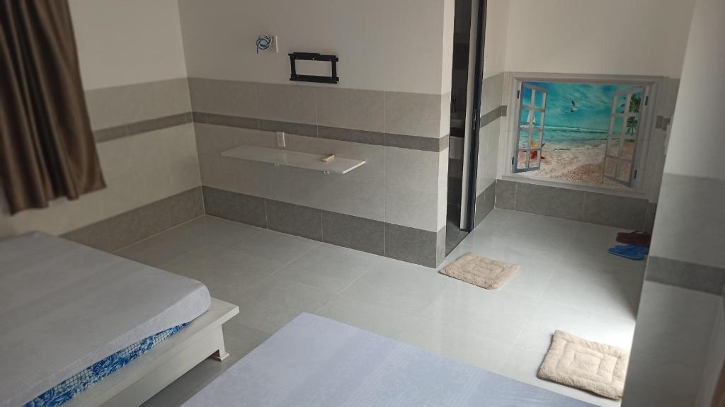 Postel nebo postele na pokoji v ubytování Cát Khuê Motel