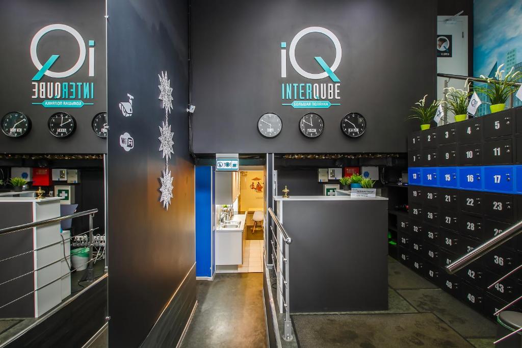 a store with clocks on the wall and a counter at Capsule Hotel InterQUBE Bolshaya Polyanka in Moscow