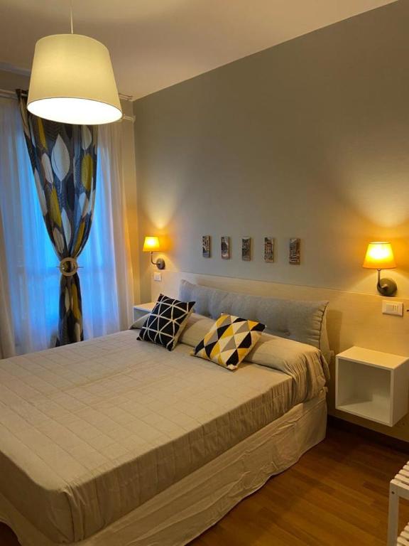 Postel nebo postele na pokoji v ubytování Hotel Il colle di Monterosso