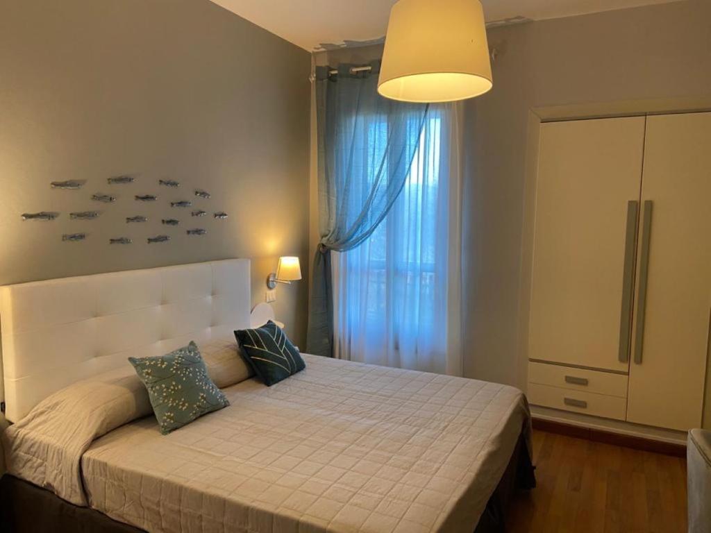 Postel nebo postele na pokoji v ubytování Hotel Il colle di Monterosso
