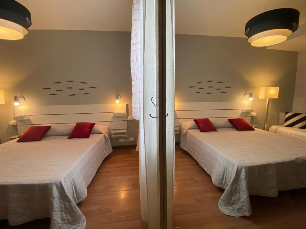 Postel nebo postele na pokoji v ubytování Hotel Il colle di Monterosso
