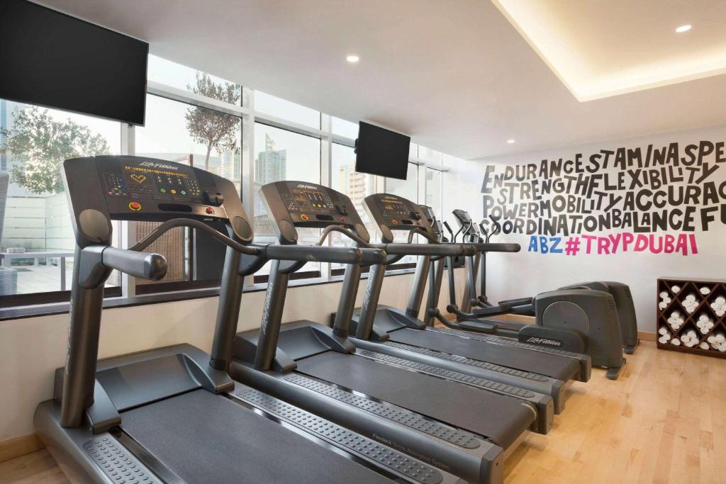 a row of treadmills in a gym at TRYP by Wyndham Dubai in Dubai