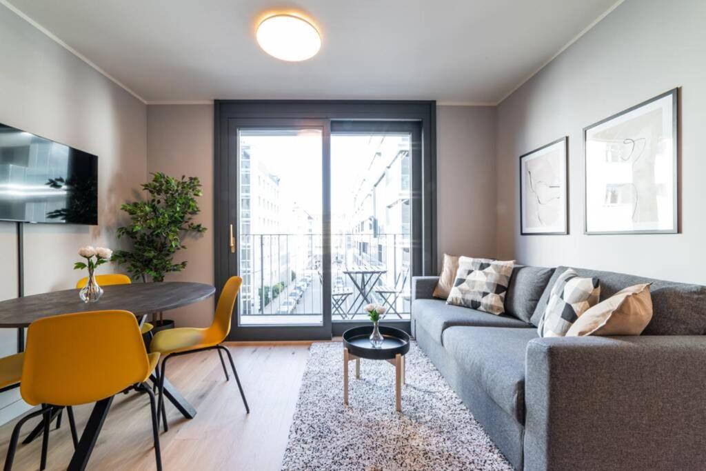 a living room with a couch and a table at Beautiful apartment in Vienna's heart 1D in Vienna