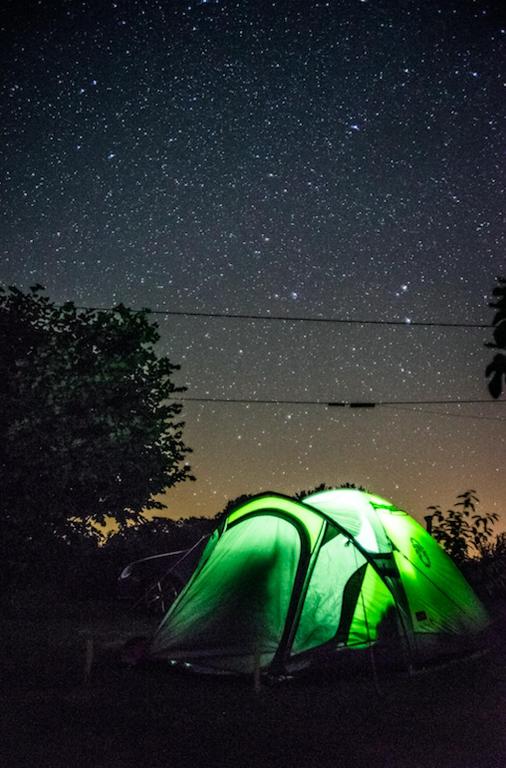 a green tent under a night sky with stars at camping chez l&#39;habitant in Noyal-Muzillac