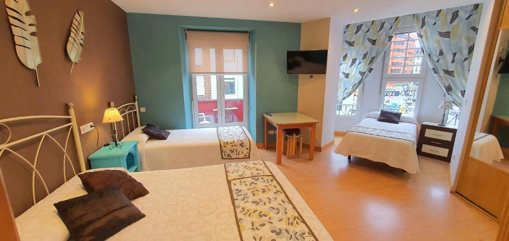 Łóżko lub łóżka w pokoju w obiekcie Hosteria Villa de Castro