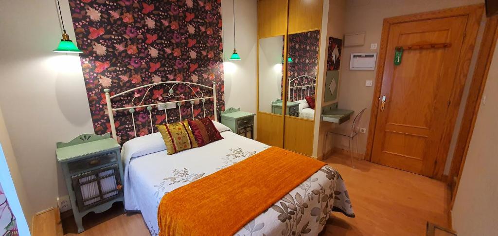 Łóżko lub łóżka w pokoju w obiekcie Hosteria Villa de Castro