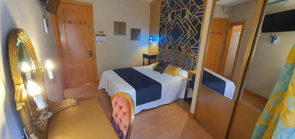 Łóżko lub łóżka w pokoju w obiekcie Hosteria Villa de Castro