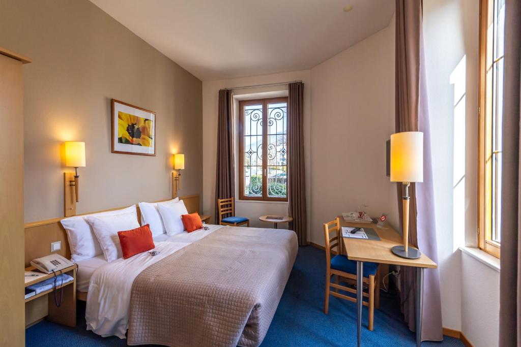 Letto o letti in una camera di Hôtel Bon Rivage