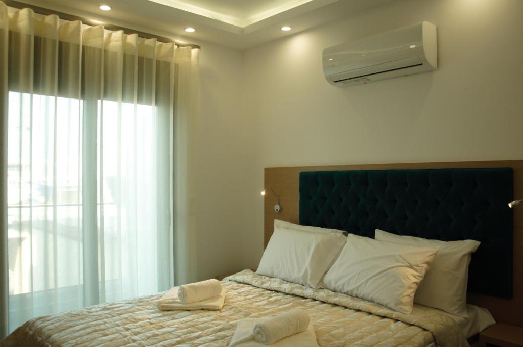Postel nebo postele na pokoji v ubytování Hotel Medusa