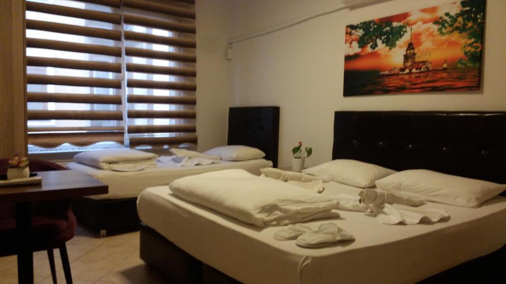 Postel nebo postele na pokoji v ubytování Hotel Kiwi