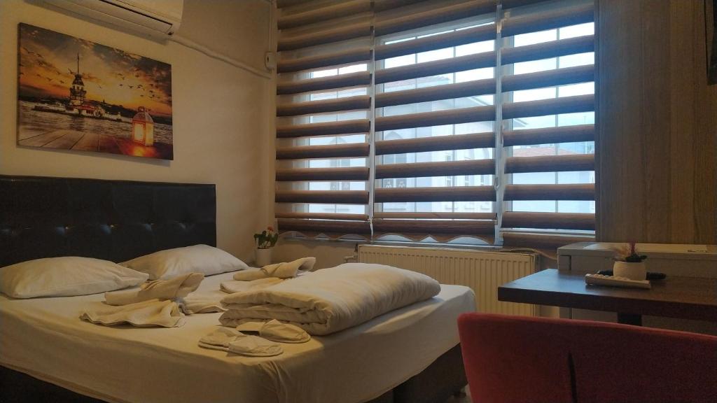 Postel nebo postele na pokoji v ubytování Hotel Kiwi