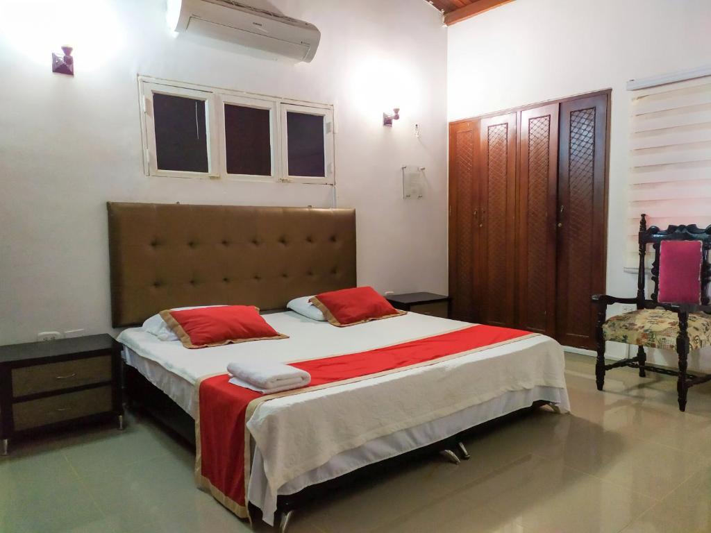 Postel nebo postele na pokoji v ubytování Hotel Plaza Colonial