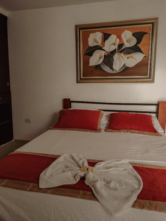 Postel nebo postele na pokoji v ubytování Hotel Plaza Colonial