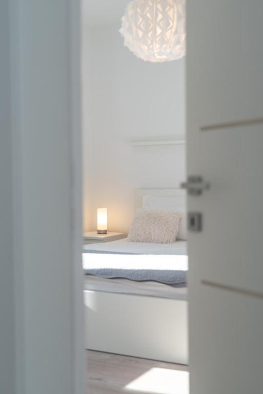 Posteľ alebo postele v izbe v ubytovaní Apartman Tragos