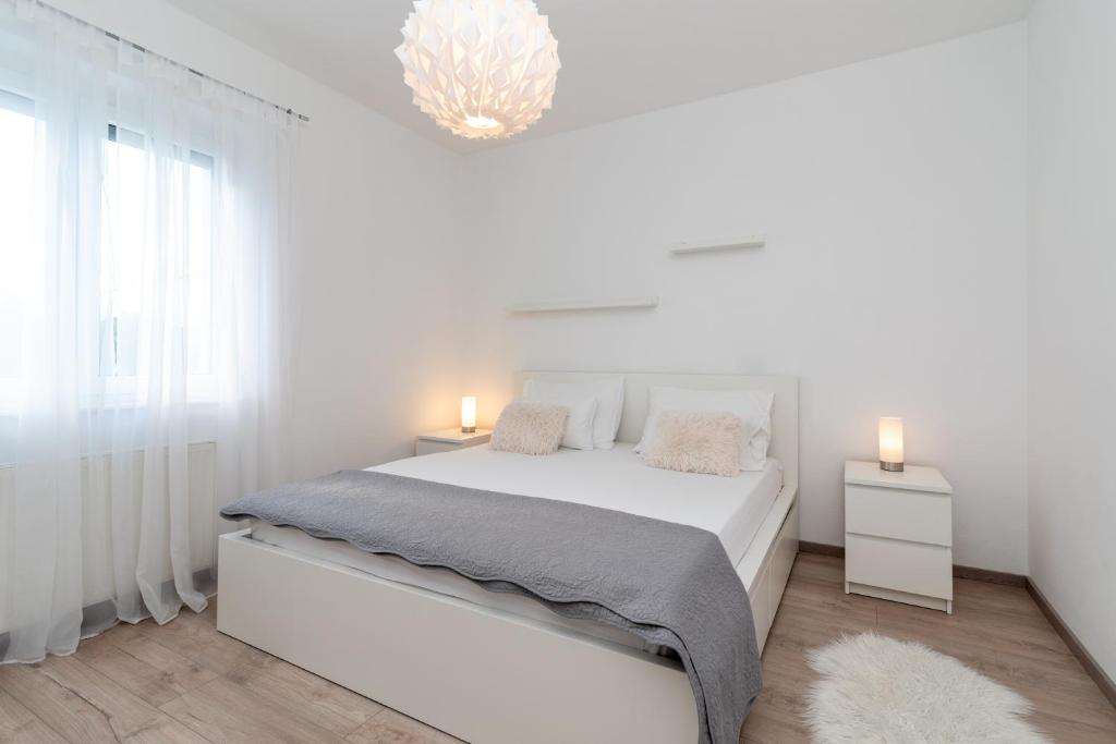 Posteľ alebo postele v izbe v ubytovaní Apartman Tragos