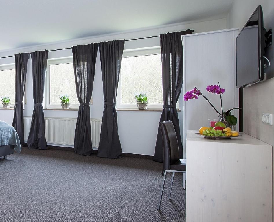 TV a/nebo společenská místnost v ubytování Alpenglühen Smart Hotel