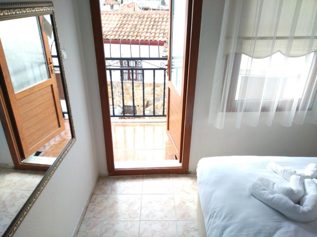 Postel nebo postele na pokoji v ubytování Anz Guest House Pansiyon