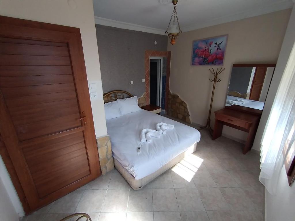 Postel nebo postele na pokoji v ubytování Anz Guest House Pansiyon