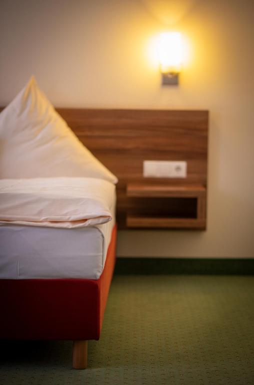 Postel nebo postele na pokoji v ubytování Wertheimer Stuben