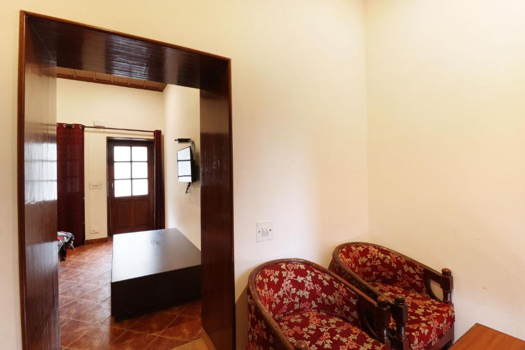 Postel nebo postele na pokoji v ubytování Hotel Himalayan Club