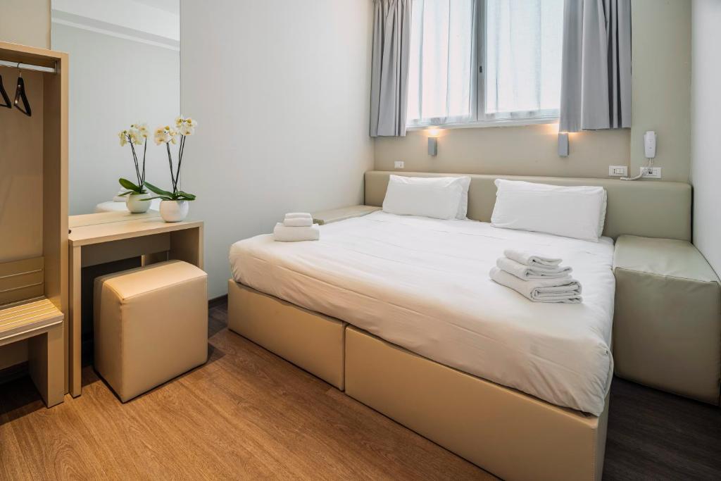 Postel nebo postele na pokoji v ubytování Fasthotel Linate