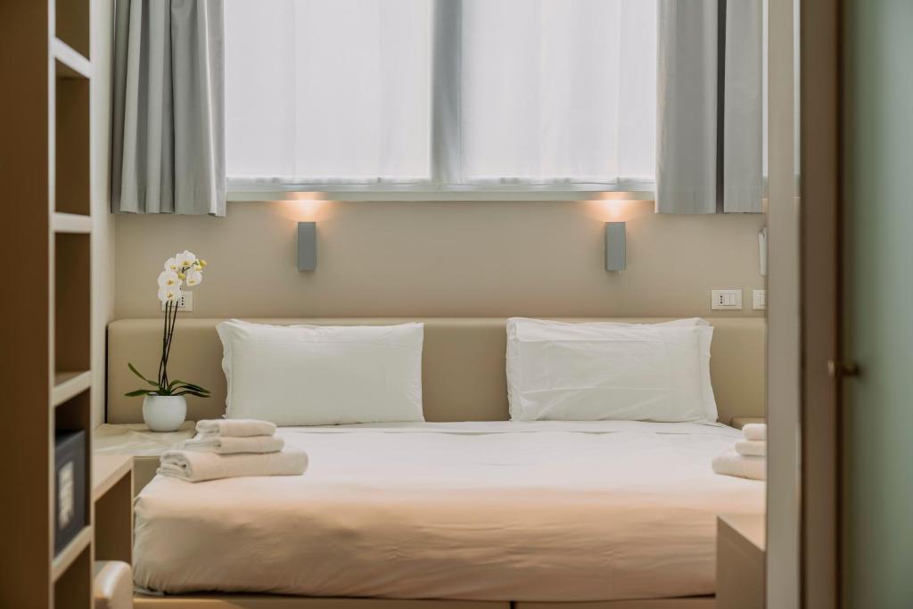 Postel nebo postele na pokoji v ubytování Fasthotel Linate
