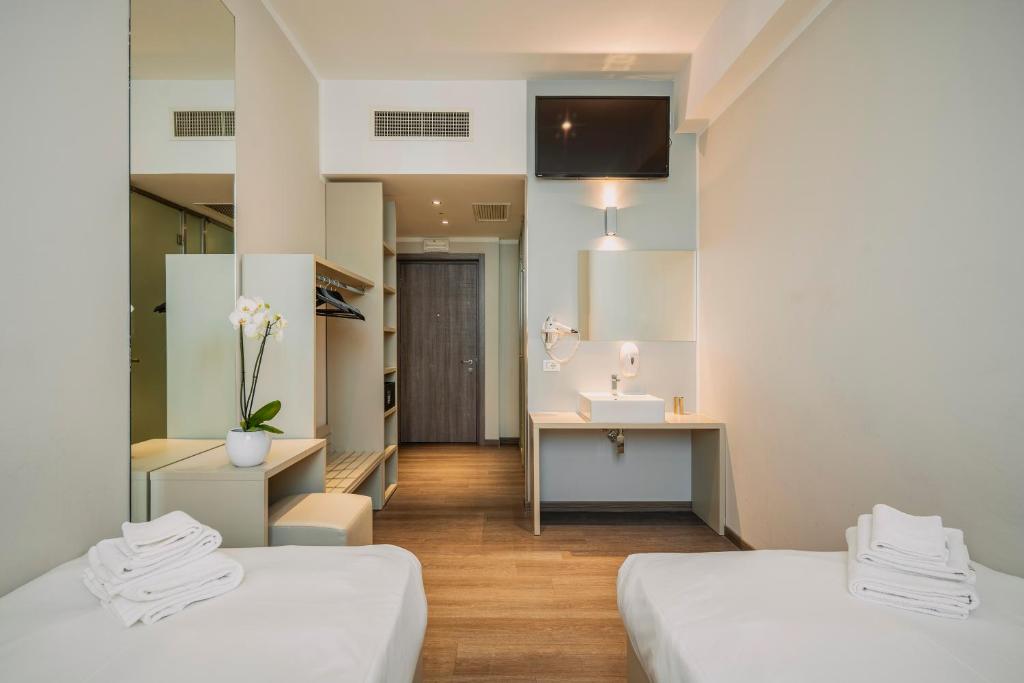 Postel nebo postele na pokoji v ubytování Fasthotel Linate