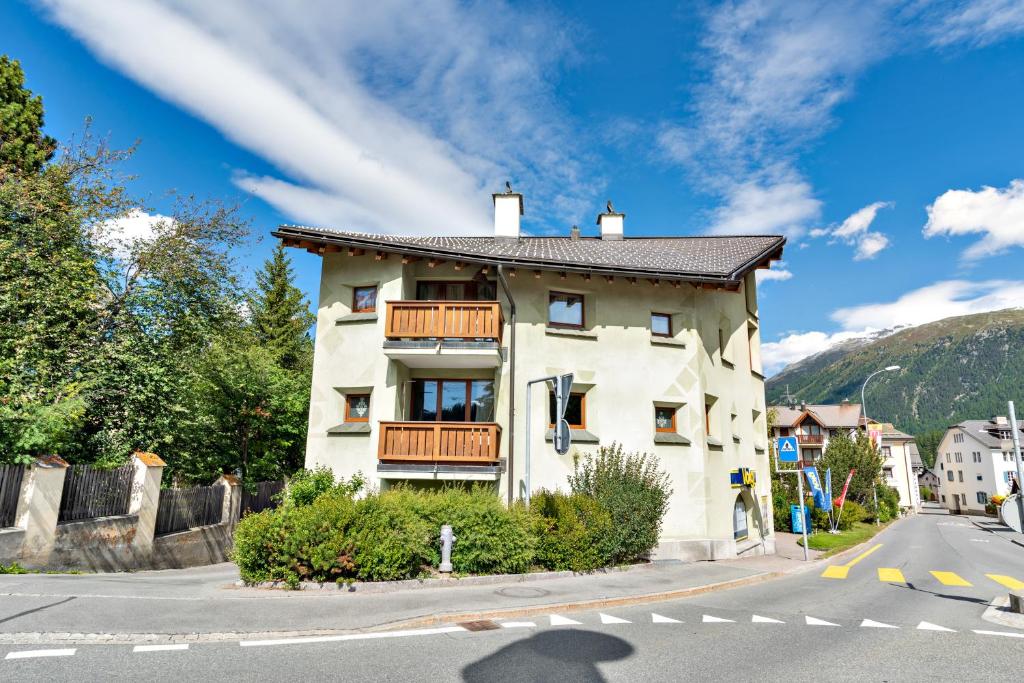 a house on the side of a street with a road at Chesa Pedra - Celerina in Celerina