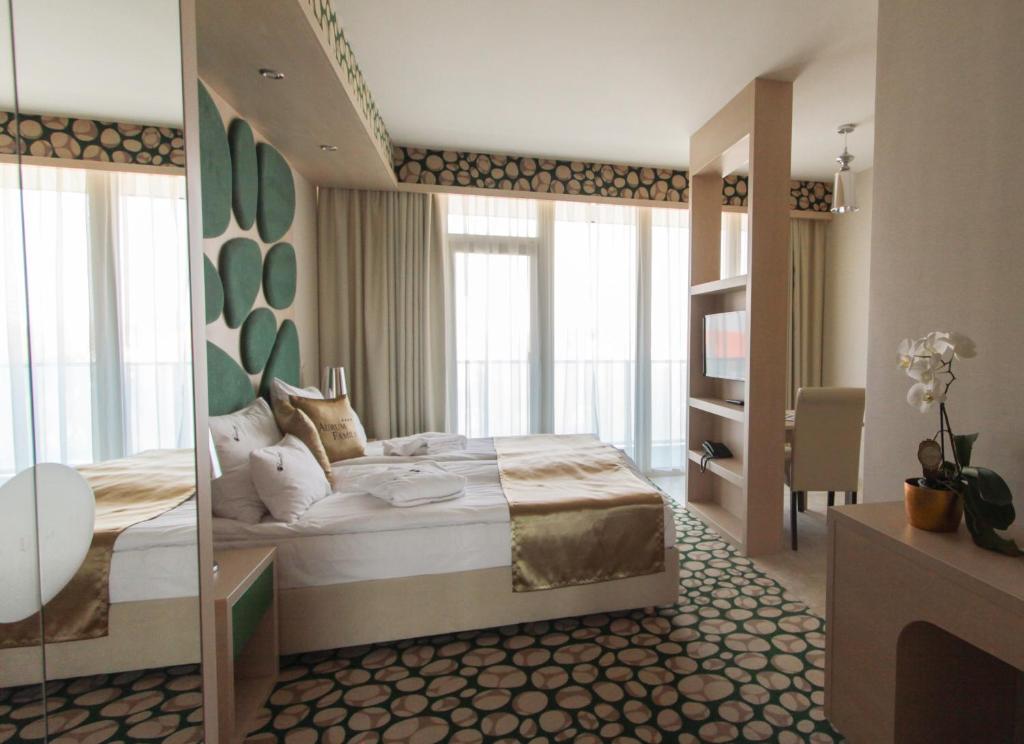 Postel nebo postele na pokoji v ubytování Hotel Aurum Family "A"