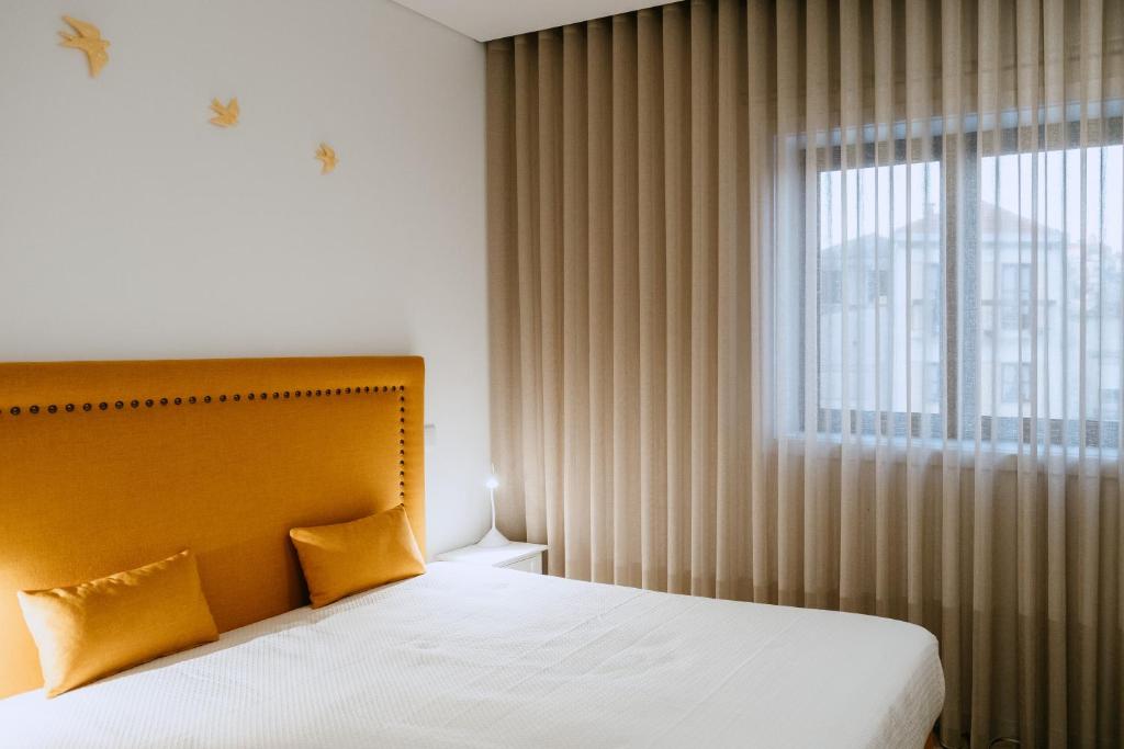 Cama ou camas em um quarto em Villa Teresa apartamentos