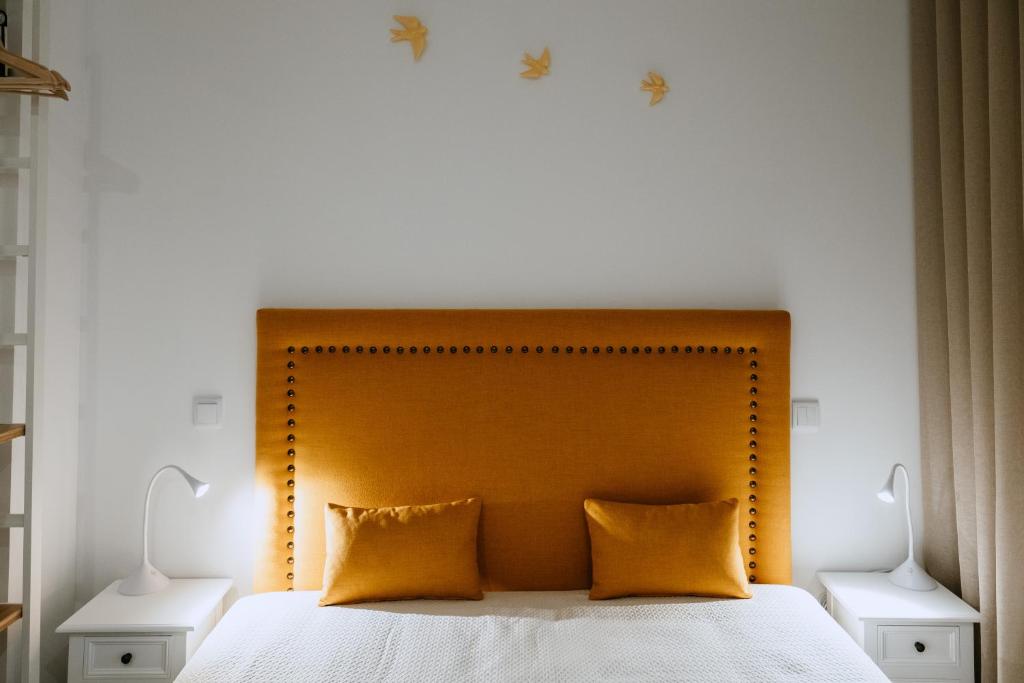 Cama ou camas em um quarto em Villa Teresa apartamentos