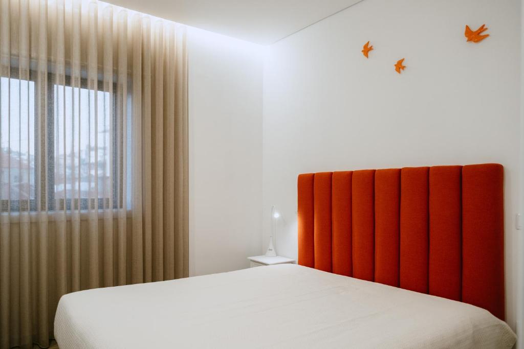 Cama ou camas em um quarto em Villa Teresa apartamentos