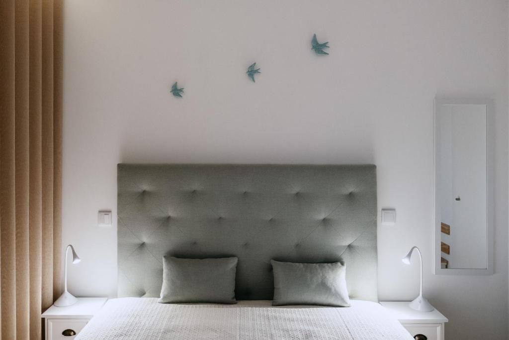 Cama ou camas em um quarto em Villa Teresa apartamentos