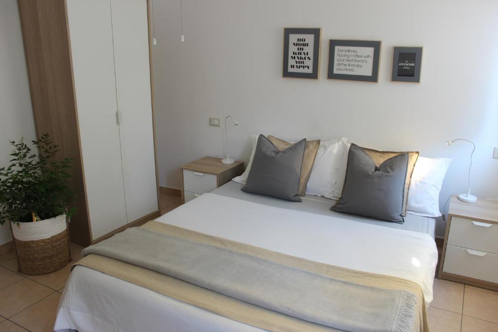 Posteľ alebo postele v izbe v ubytovaní Casa Vacanze Giorgetta 2-3 piano