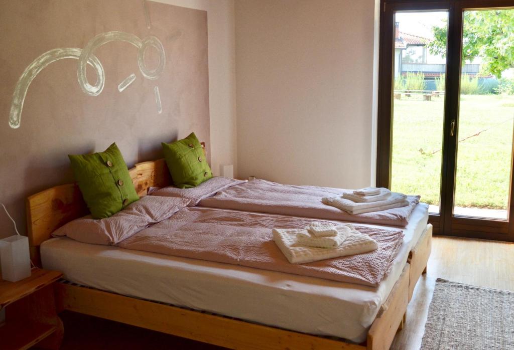 Postel nebo postele na pokoji v ubytování Le Ali del Falco