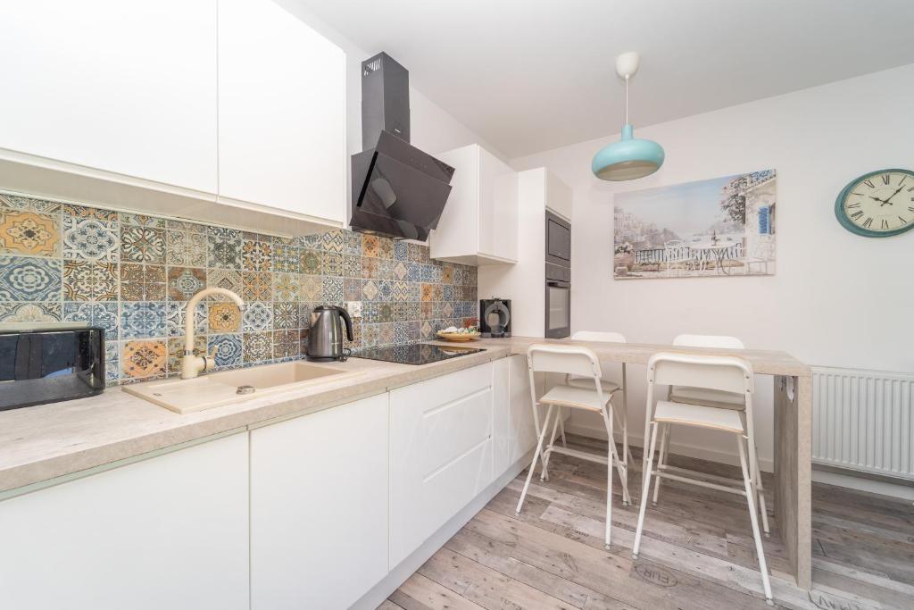 Kuchyňa alebo kuchynka v ubytovaní Chodkiewicza Apartment