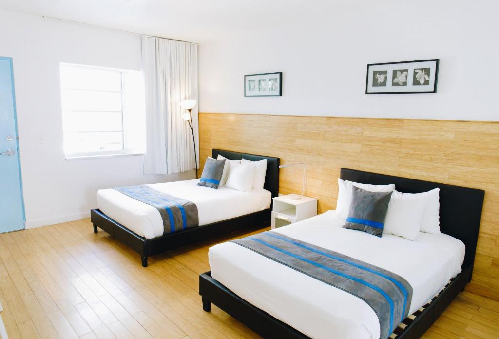Postel nebo postele na pokoji v ubytování Aqua Hotel & Suites