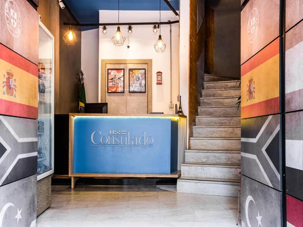 a lobby with a blue sign in a building at MOVA 104 - Hotel Consulado Avenida Paulista in São Paulo