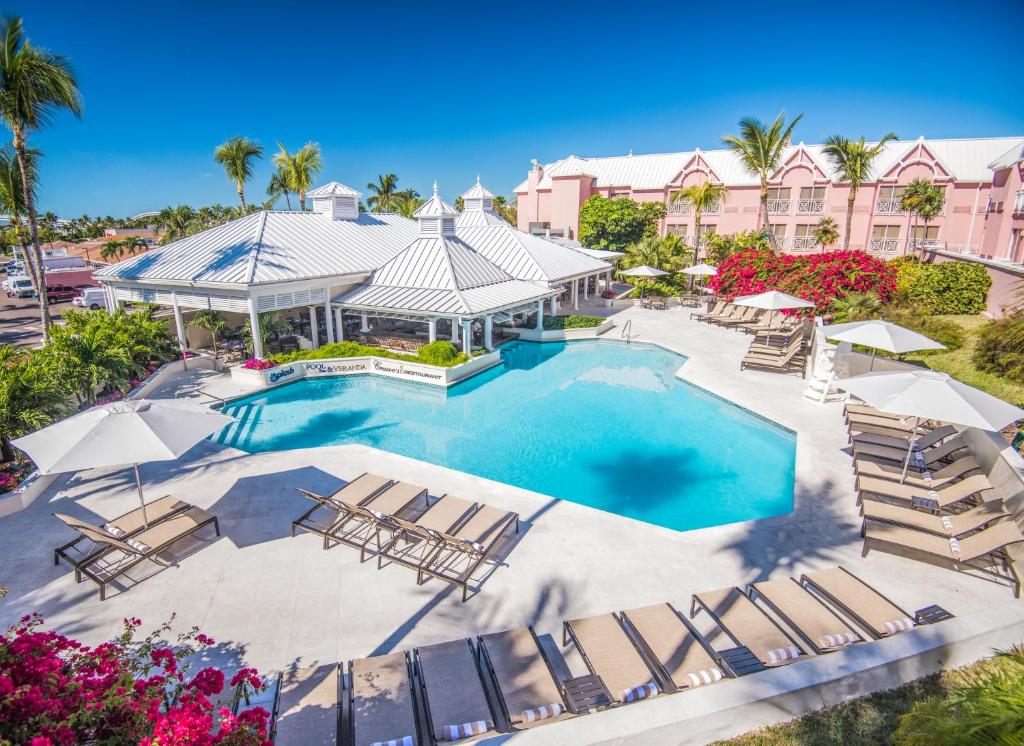 an overhead view of a swimming pool with lounge chairs and a resort at Comfort Suites Paradise Island in Nassau