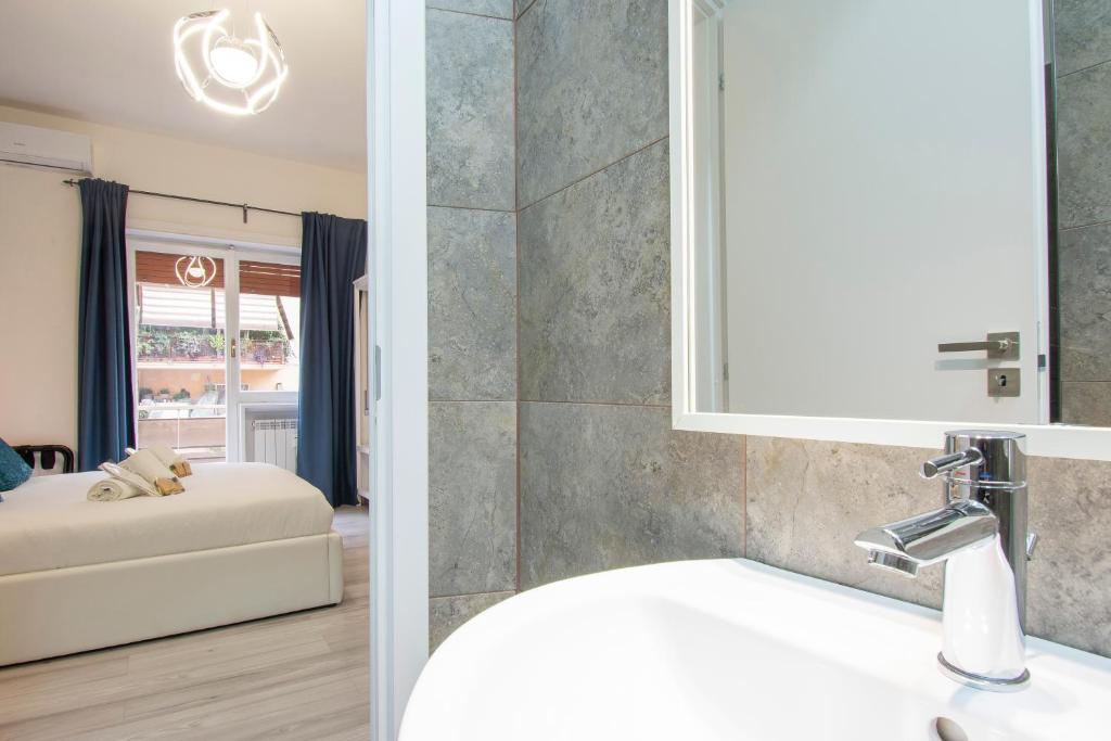 a bathroom with a sink and a mirror at Luxury Boutique Hotel in Rome