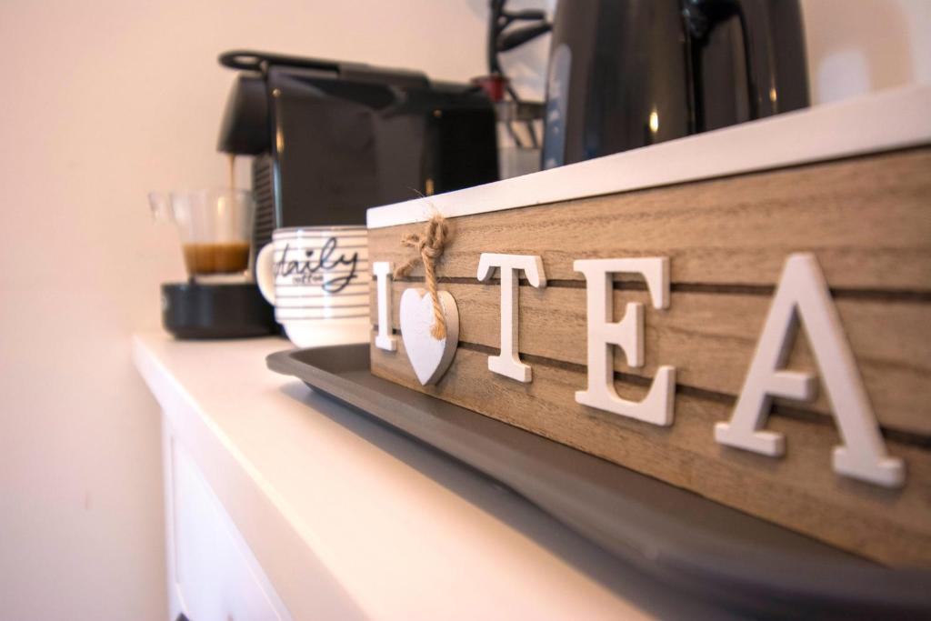 a shelf with a sign that reads caffe at Luxury Boutique Hotel in Rome